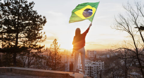 woman-holding-brazilian-flag-full-shot